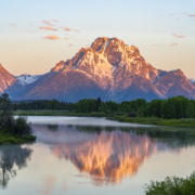 landscape of snow mountain reflecting in the lake in the morning